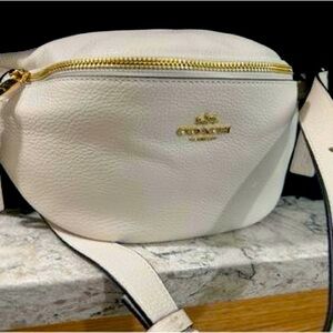 Cream colored leather Coach Belt Bag.